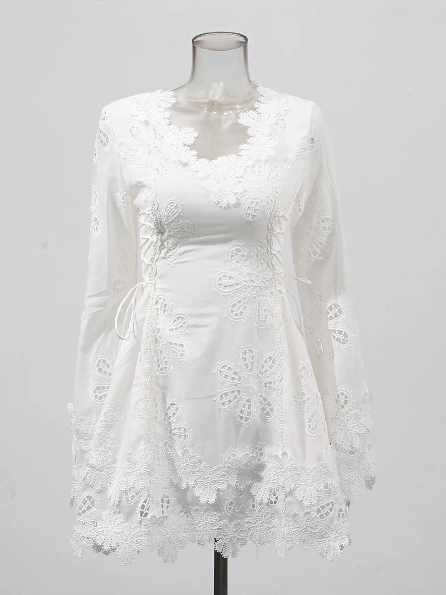 TWOTWINSTYLE solide évider Mini robes pour femmes col en V longue sans manches taille haute tempéram