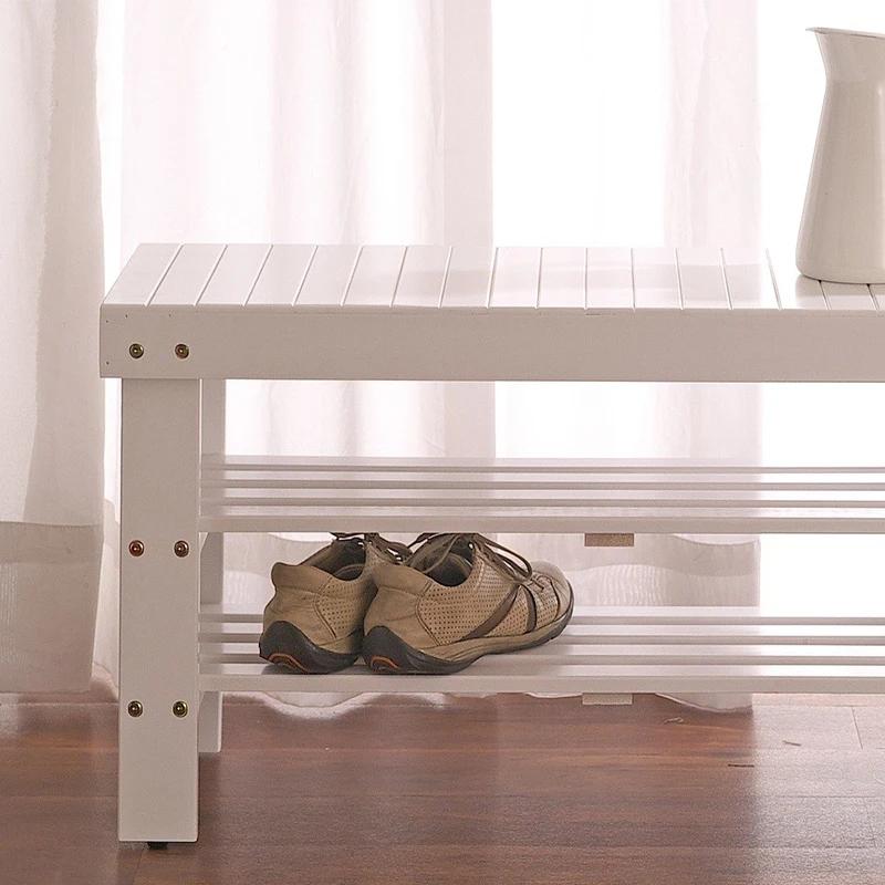 Banc à chaussures en bois massif de qualité Pina, finition blanche sur place