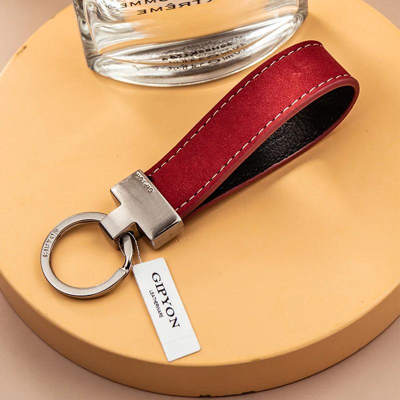 Corde de poignée exquise de haute qualité, pendentif de porte-clés Simple en peau de vache, anneau d