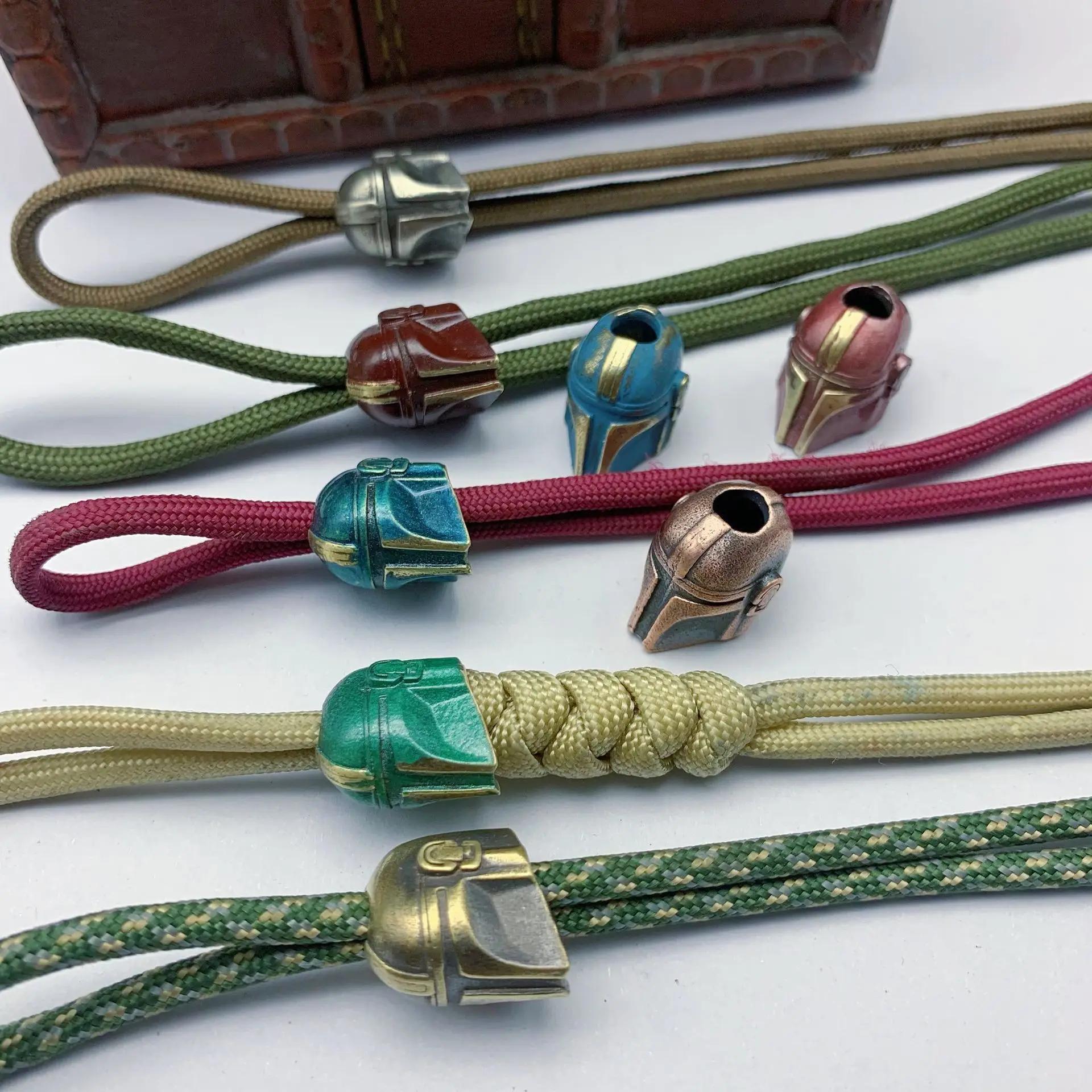 Casque Alien couteau pliant perle paracorde tissé lanière porte-clés pendentifs en laiton bricolage