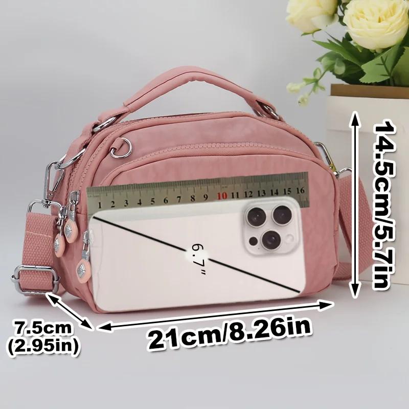 Sac à bandoulière en nylon multi-poches pour femme, sac à main à la mode avec bandoulière amovible.