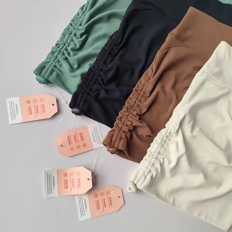 Shorts de yoga taille haute ajustables pour femmes avec cordon de serrage, effet push-up et contrôle