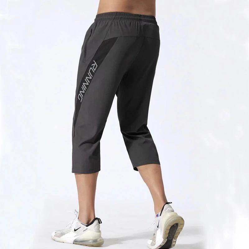 Pantalon sport homme poches zippées - Jogging entraînement 3/4 - Musculation football fitness running