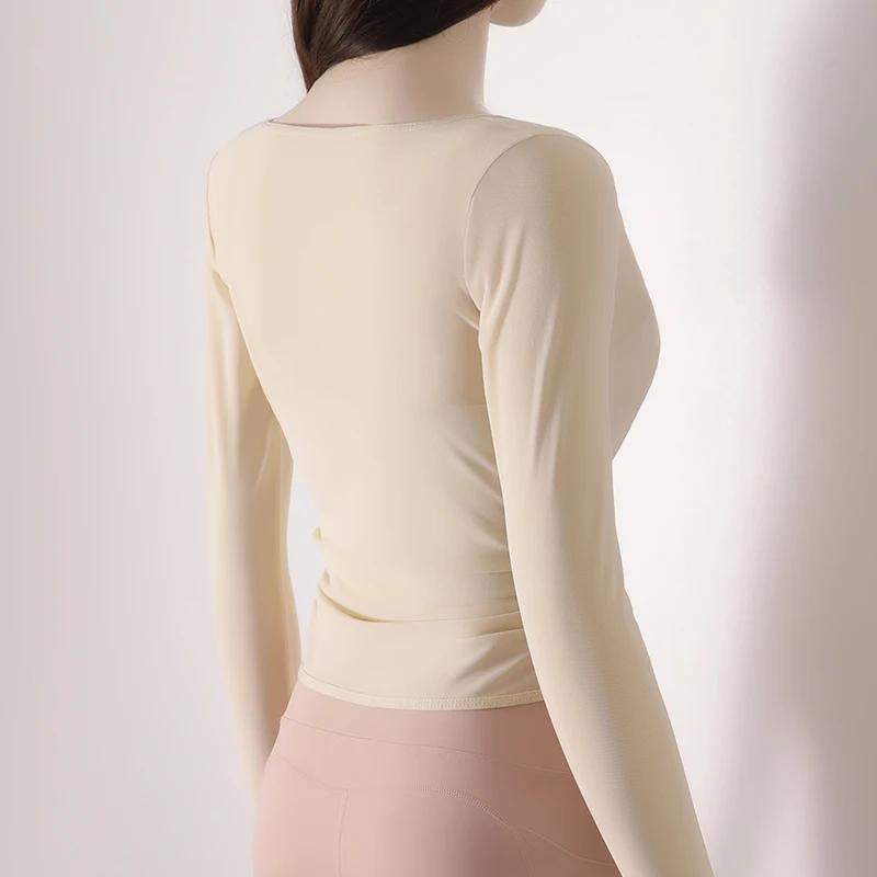 Fil de filet en nid d'abeille portant un exercice mince à manches longues taille respirante t-shirt