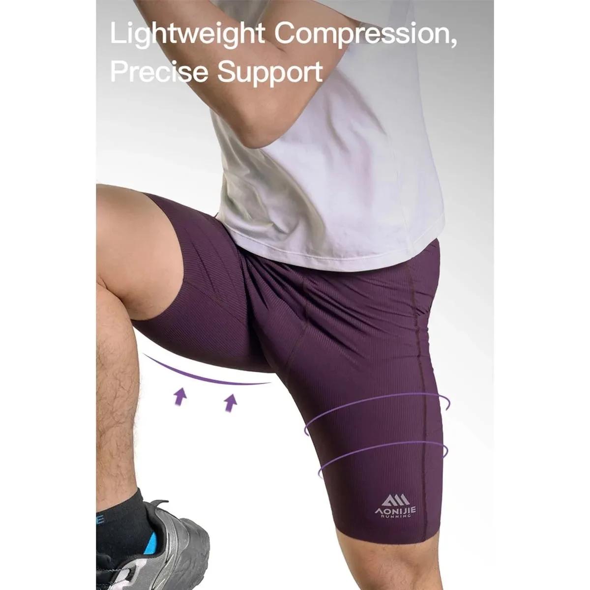 AONIJIE FM5255 Short de compression haute élasticité à séchage rapide et respirant avec poches pour