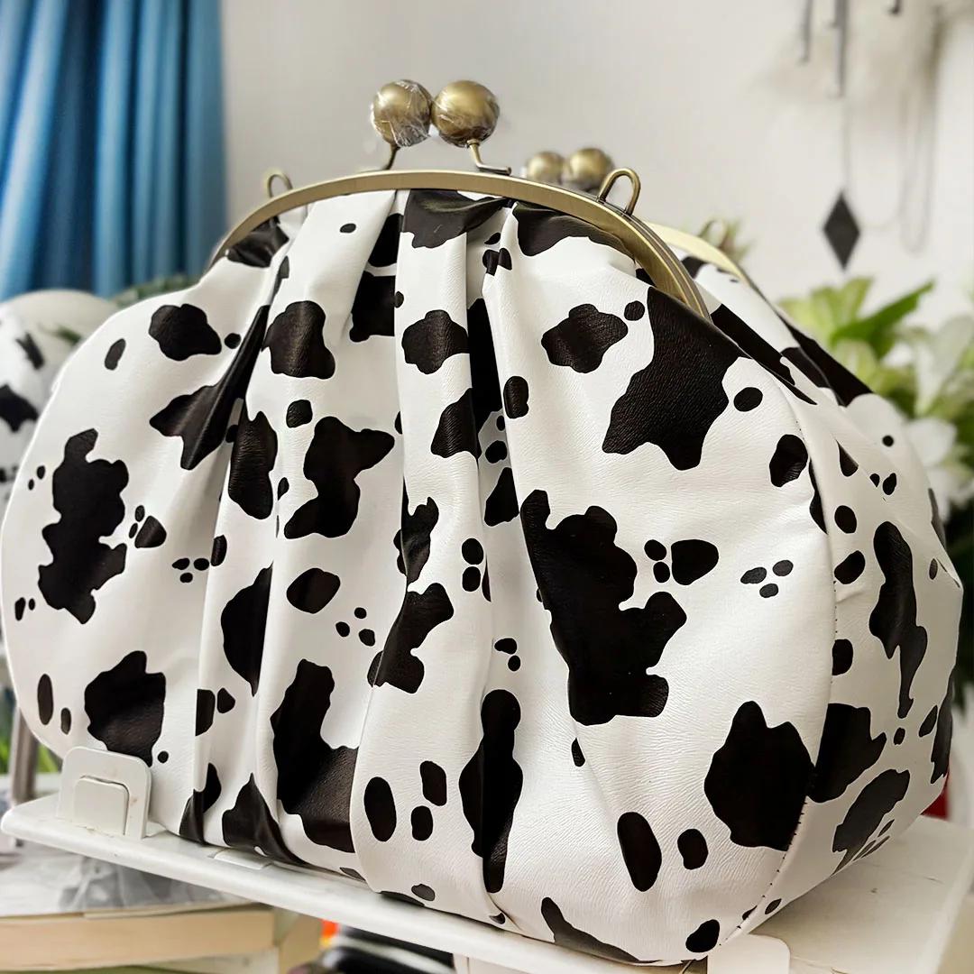LOST IN VINTAGE – pochette en tissu à motif de vache