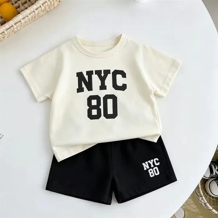 Ensemble de survêtement mode pour enfant t-shirt noir et short d été tenue à col rond pour bébés garçons et filles ensemble short à manches courtes pour activités quotidiennes sorties familiales et occasions spéciales
