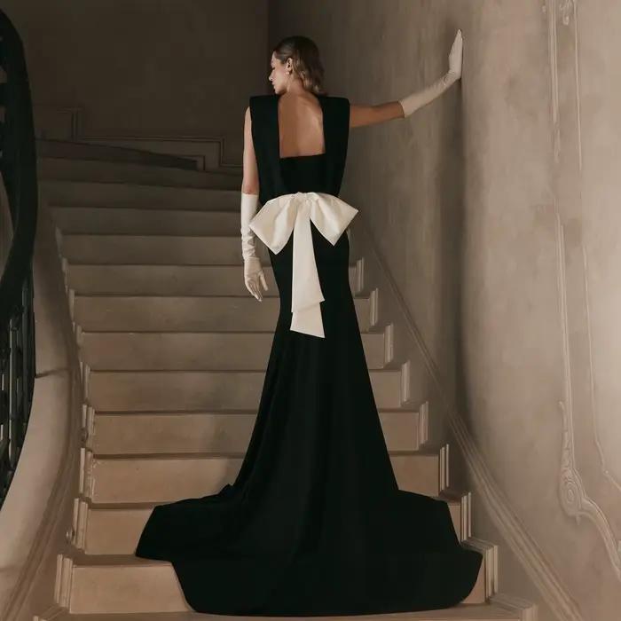 Robe de soirée sirène noire fluide sans dos pour femme, robe de bal longue sans manches avec nœud bl