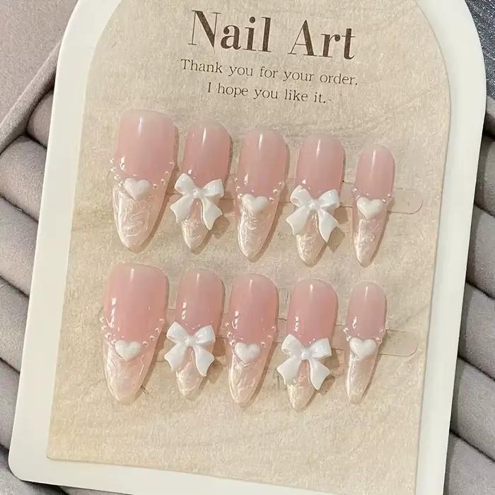 Faux ongles français haut de gamme en forme de cœur, nœud rose, faits à la main, patchs pour ongles