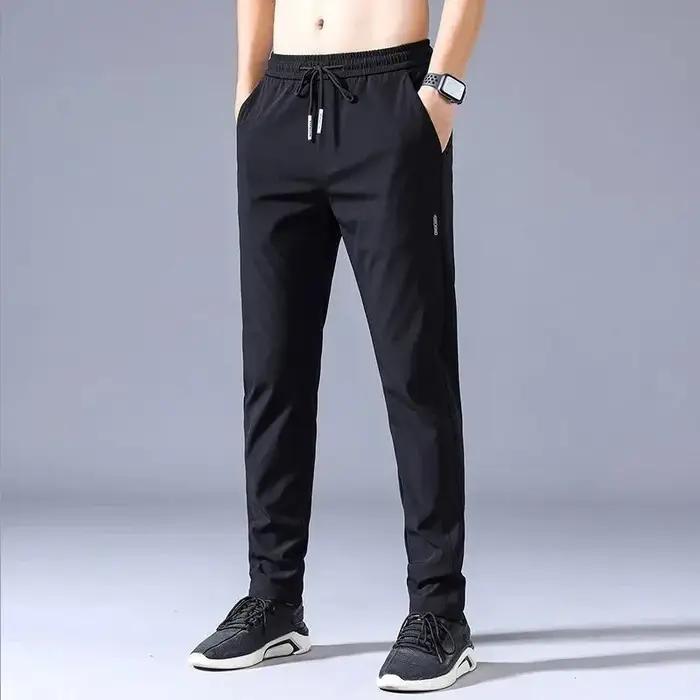 Pantalons hommes 2025 été noir gris élastique respirant coupe moderne pour activités extérieures et tenues décontractées