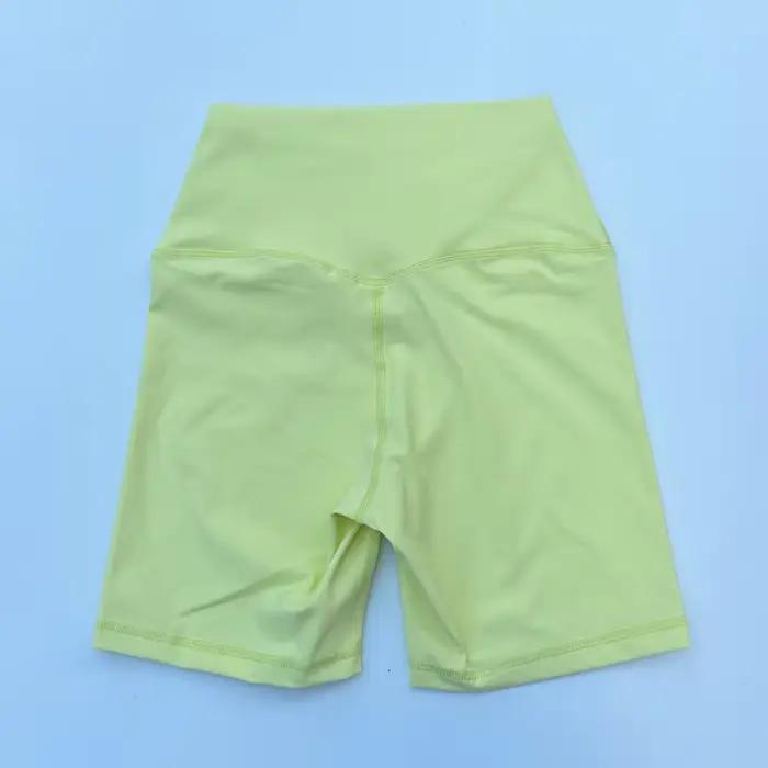 Short de sport taille haute femme en nylon élastique avec effet push-up pour yoga course à pied et entraînement fitness