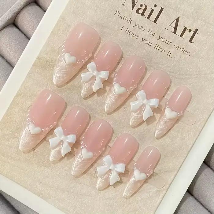 Faux ongles français haut de gamme en forme de cœur, nœud rose, faits à la main, patchs pour ongles