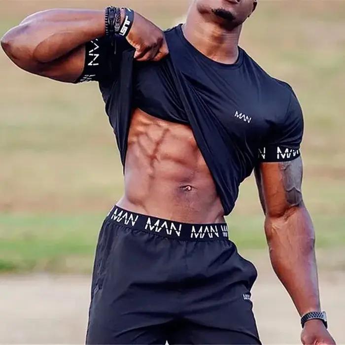T-shirt compression homme pour gym et course - Haut sportif respirant d'été pour entraînement fitness