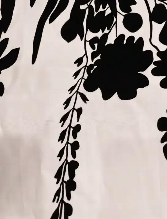 Robe élégante noire et blanche pour femme, idéale pour le travail, les rendez-vous et les vacances
