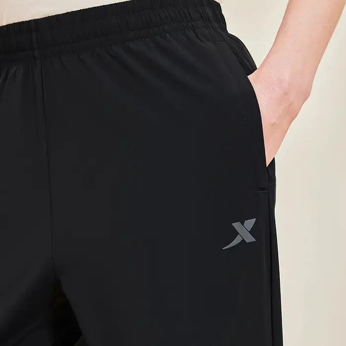 Xtep Little C pantalon pour hommes été pantalon absorbant la sueur à la mode rétro mode bas à séchag